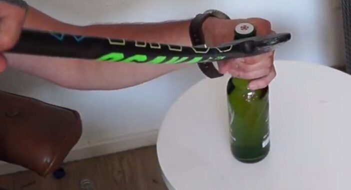 Use a stick to open the bottle